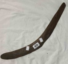 A hand carved wooden boomerang