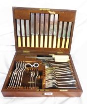 An oak canteen containing a part six place setting of Walker & Hall silver plated cutlery - sold
