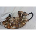 A silver pated four piece tea set, on oval tea tray - sold with a plated goblet