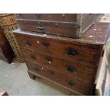 A 1.1m antique mahogany and mixed wood chest of three long graduated drawers, set on raised