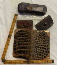 A small alligator skin wallet with 9ct. gold corner mounts - sold with a leather sleeved boxwood