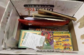 A box containing a quantity of Meccano instruction booklets and manuals