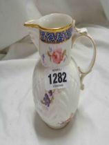 A Coalport bone china 'Caughley' mask head jug with floral decoration