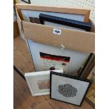 A box containing a selection of framed prints - various artists and subject