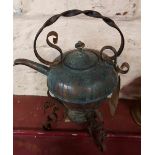 A copper spirit kettle on stand with burner