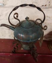 A copper spirit kettle on stand with burner