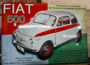 A vintage Fiat 500 enamel advertising sign