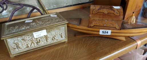 A musical Sorento ware gondola cigarette box and a cast brass box
