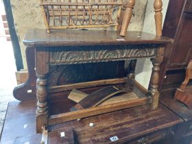 A 74cm 20th Century oak joint style stool with carved frieze, set on turned supports and open