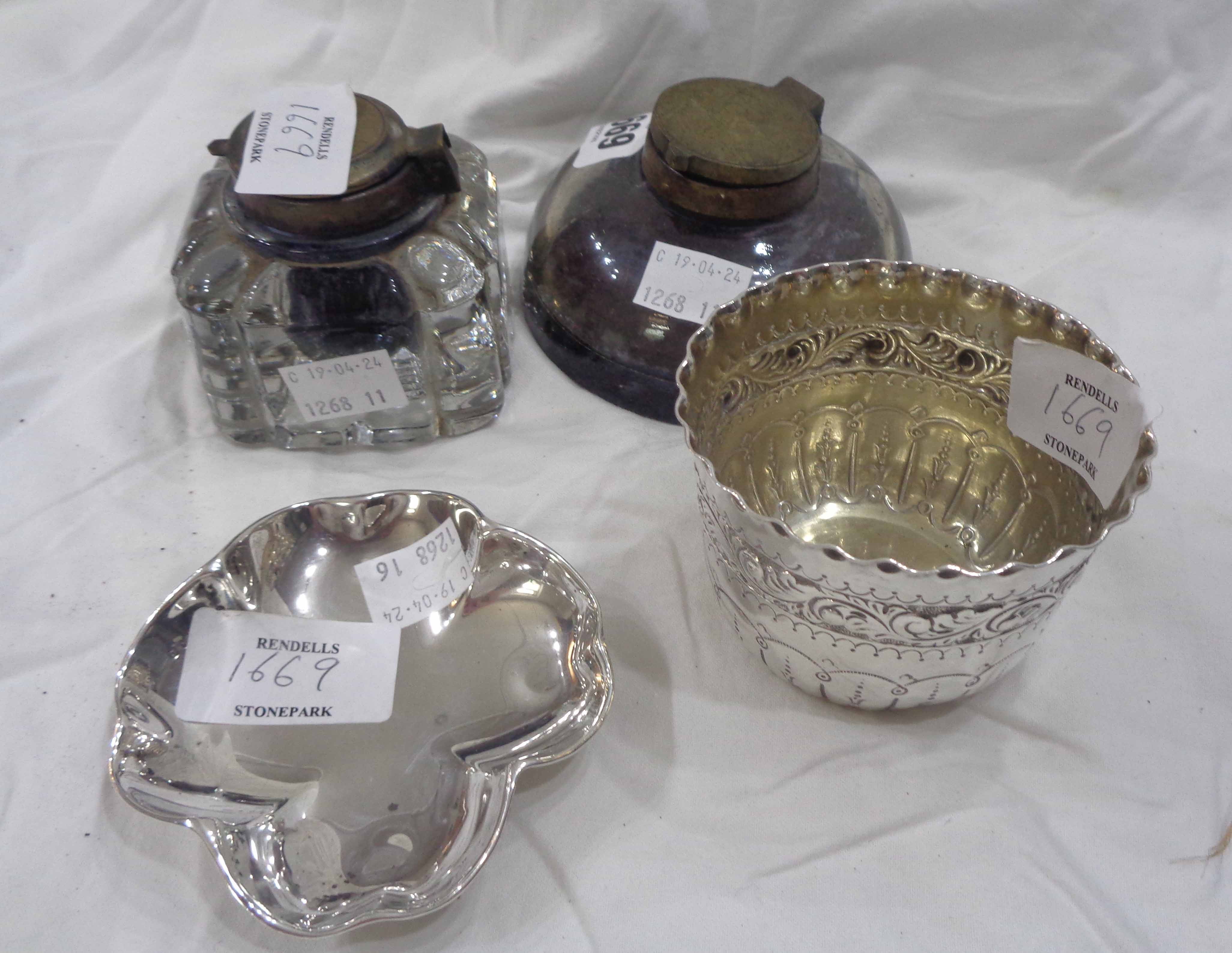 A small silver pot with embossed decoration - London 1885 and a silver petal shaped pin tray -