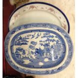 A blue and white transfer printed Willow pattern meat plate - sold with another