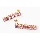 A pair of 375 (9ct.) gold articulated drop earrings, each set with five amethysts