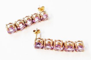 A pair of 375 (9ct.) gold articulated drop earrings, each set with five amethysts