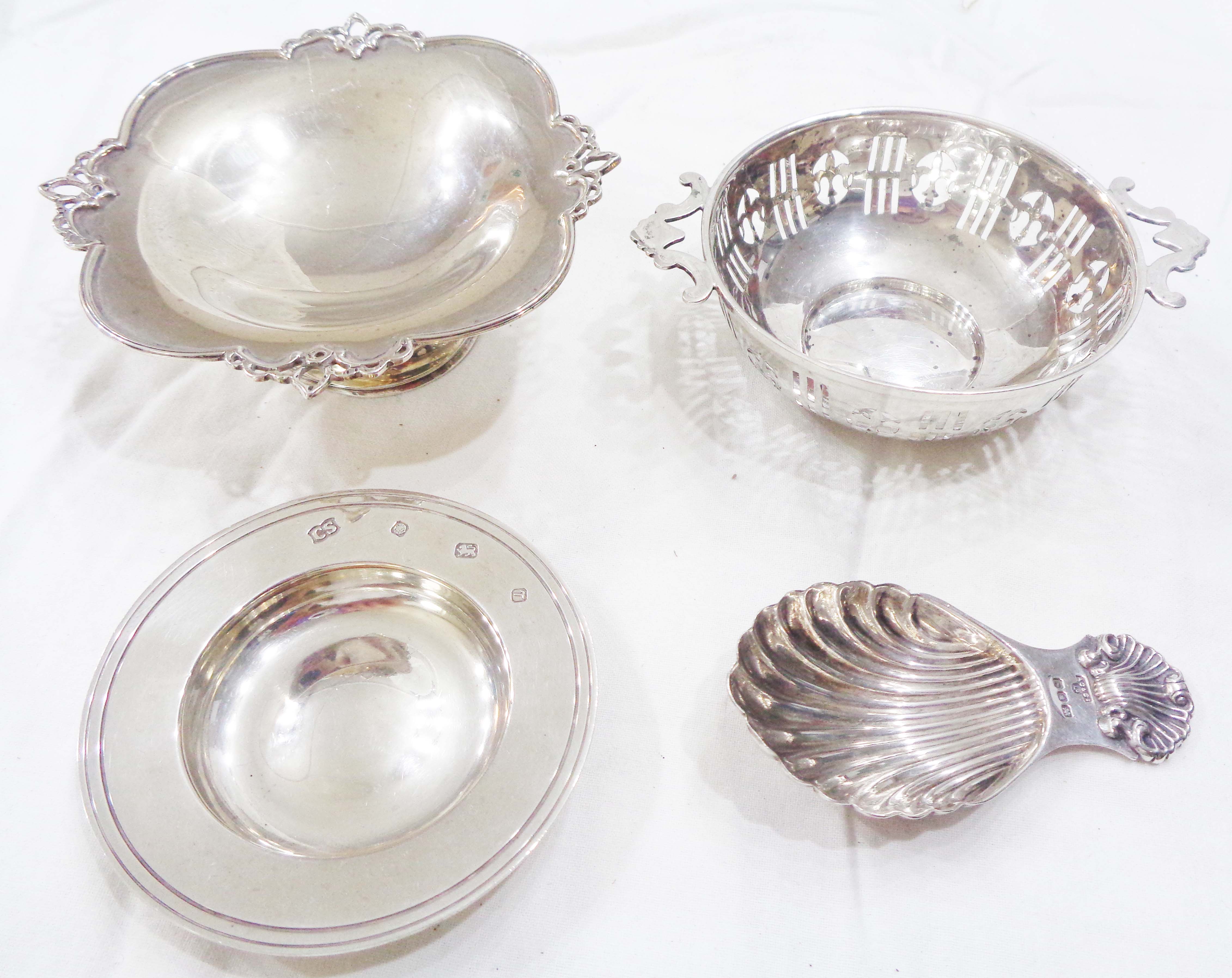 A small silver pedestal bon bon dish - sold with another with flanking handles and pierced