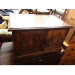 A 76cm Brights of Nettlebed oak media cabinet enclosed by a pair of panelled doors