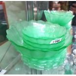 A quantity of 1930's pressed green uranium glass bowls and plates