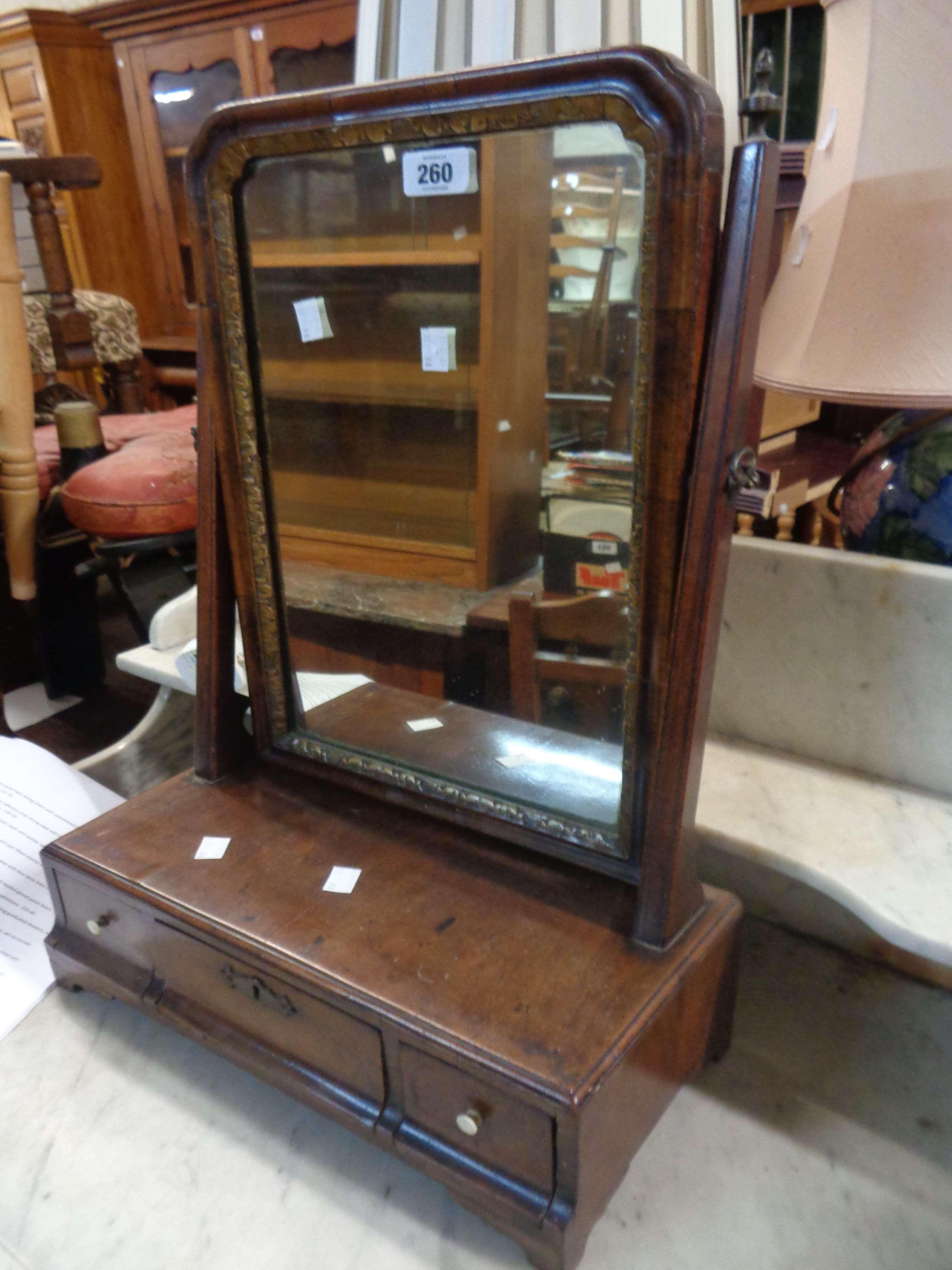 A 19th Century mahogany platform dressing table mirror with shaped plate and three drawers to