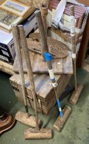 An old croquet set comprising four mallets, hoops, mallet stand and box
