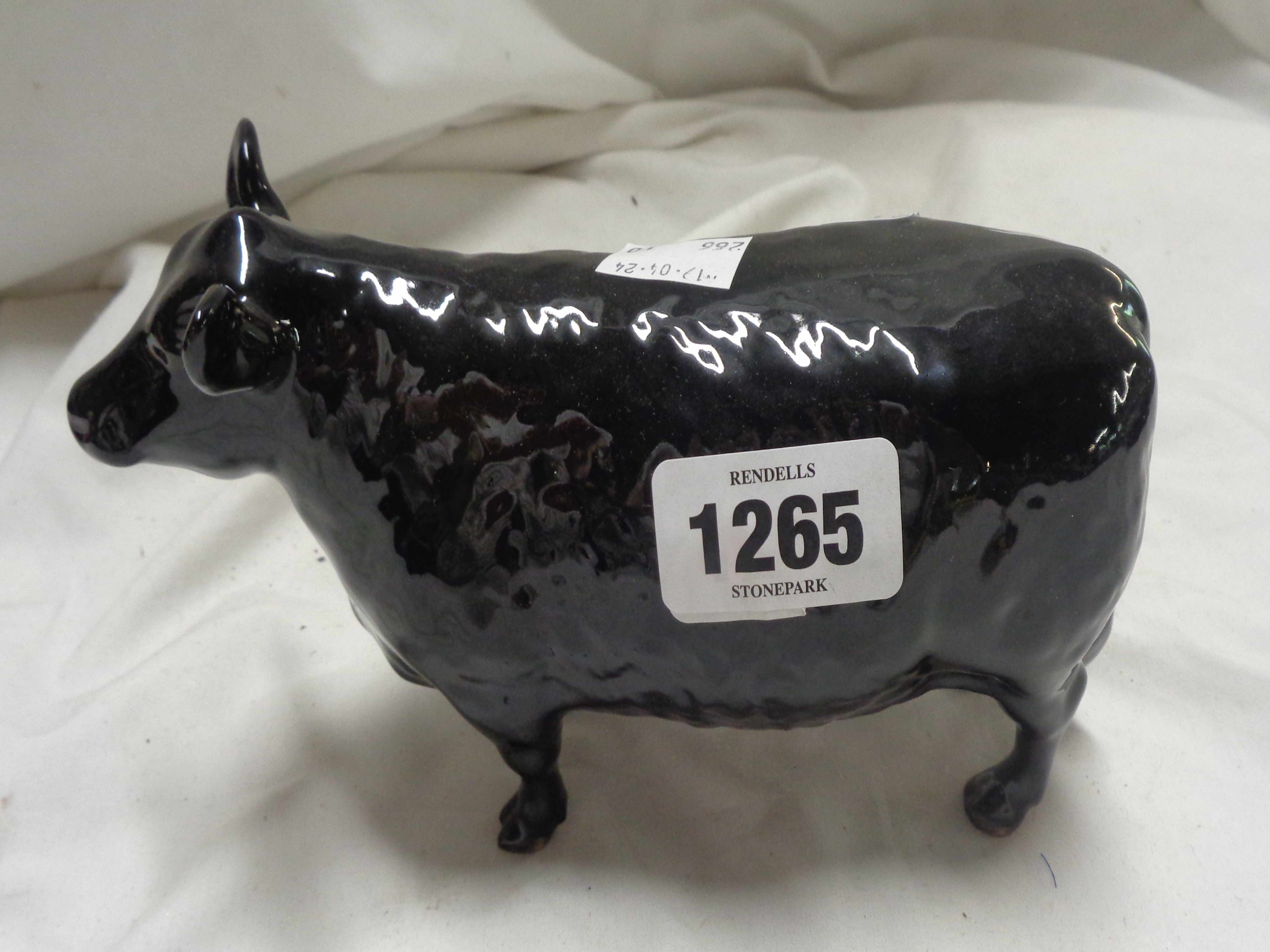 A Beswick Angus cow figurine, model No.1563 with black glaze finish and gold 'Angus Society'