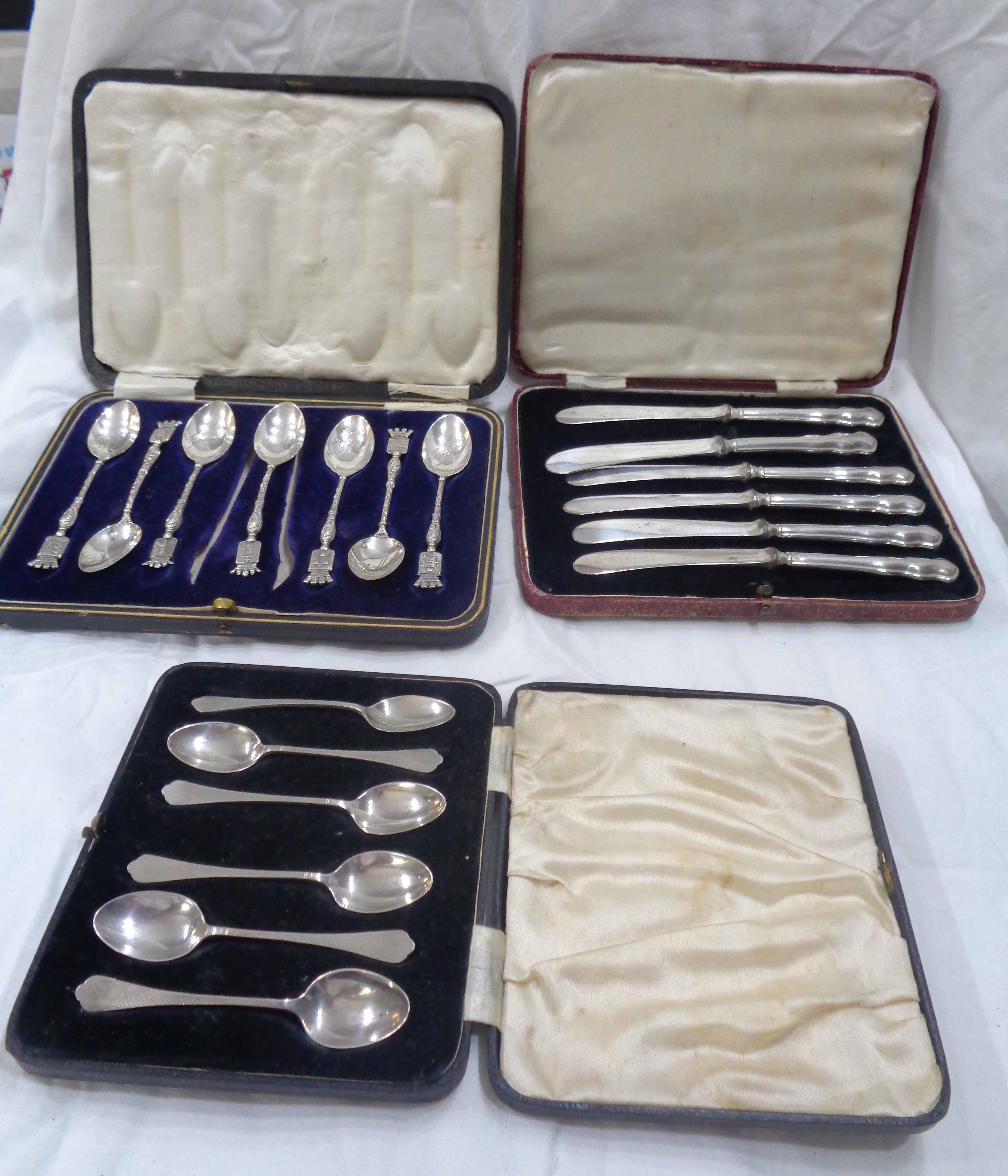 A cased set of six English silver coffee spoons - sold with a cased set of six silver handled butter