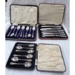 A cased set of six English silver coffee spoons - sold with a cased set of six silver handled butter