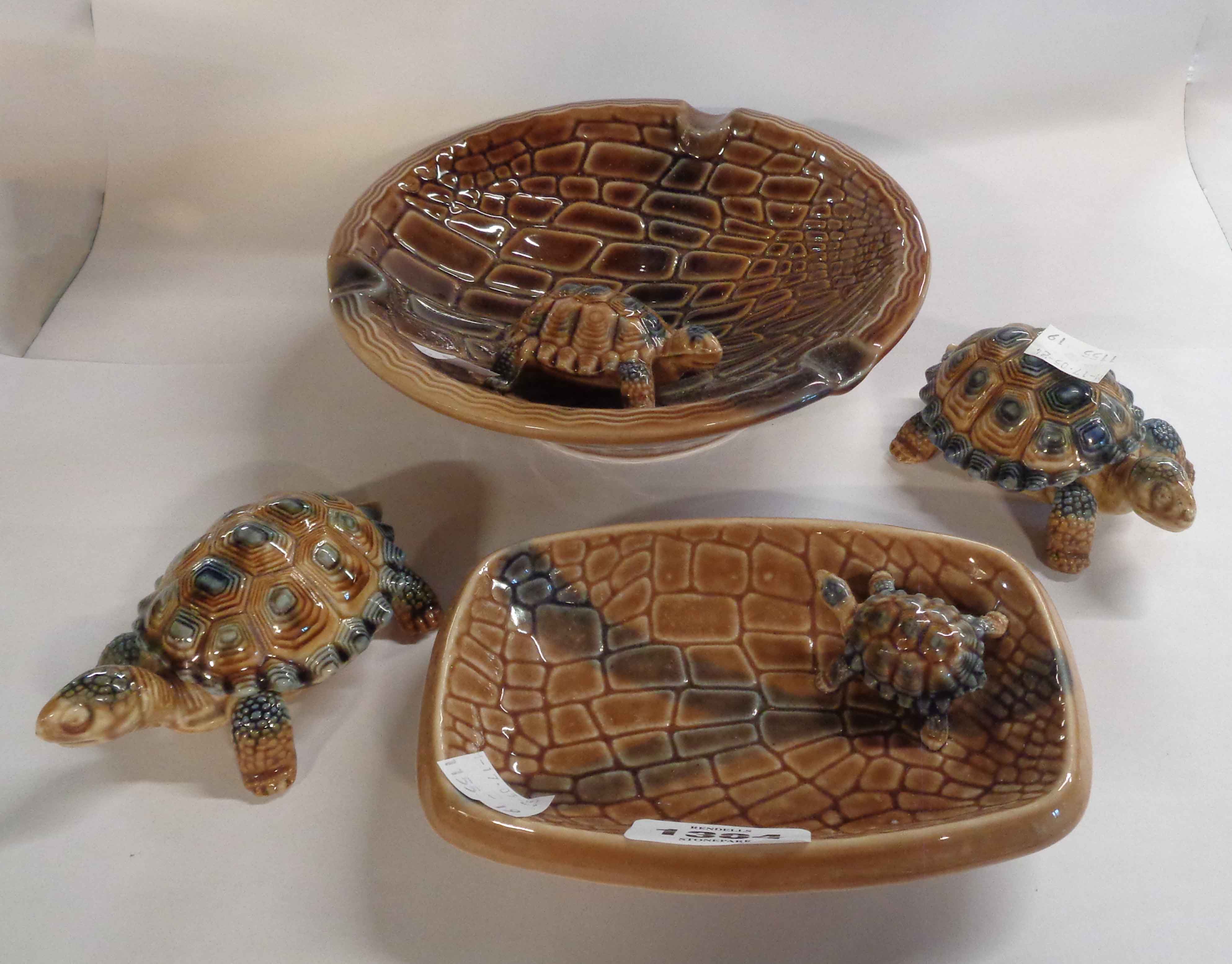 A large Wade porcelain tortoise decorated ashtray, a smaller similar and two tortoise form trinket