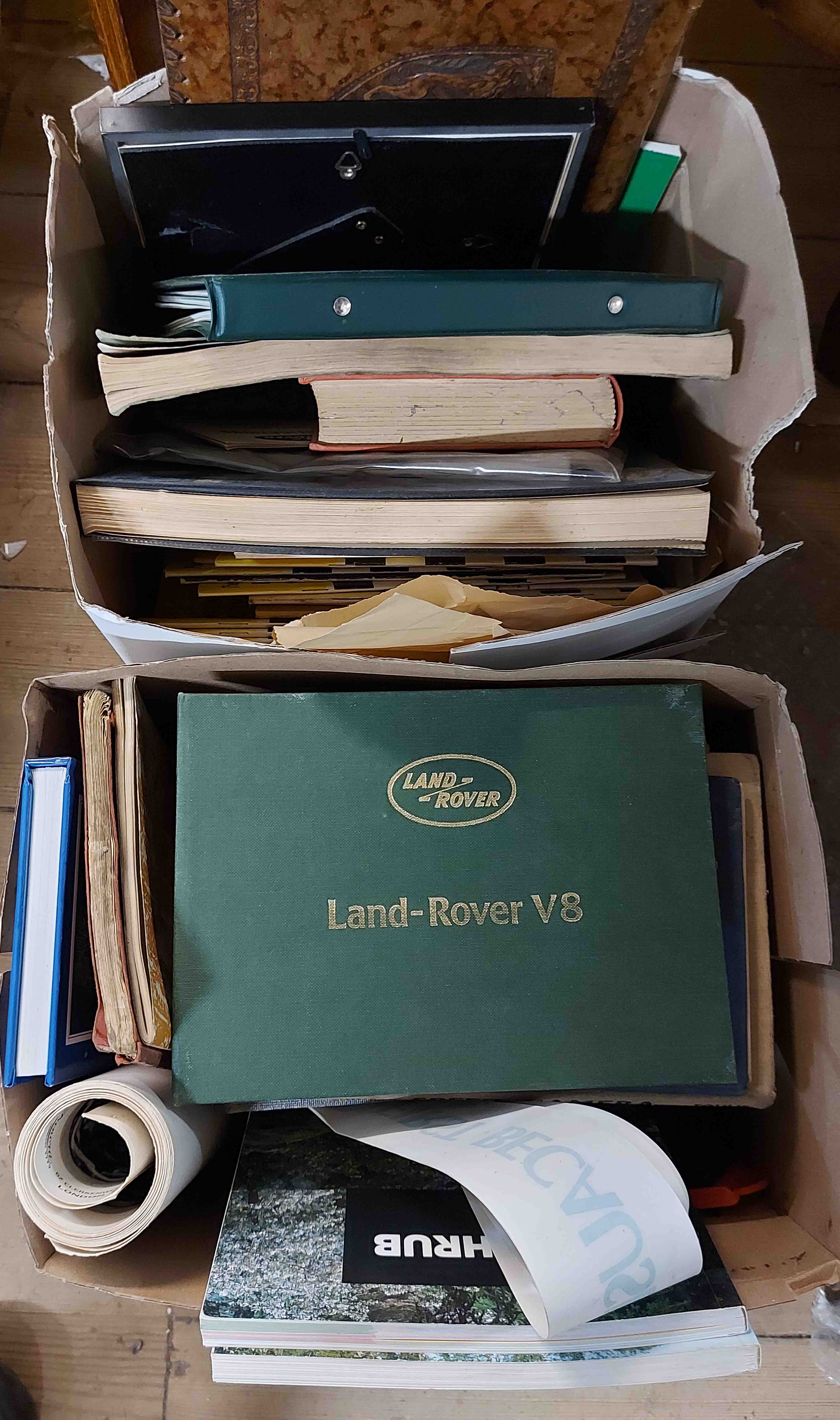 Two boxes containing car related books including Land Rover manuals, etc.
