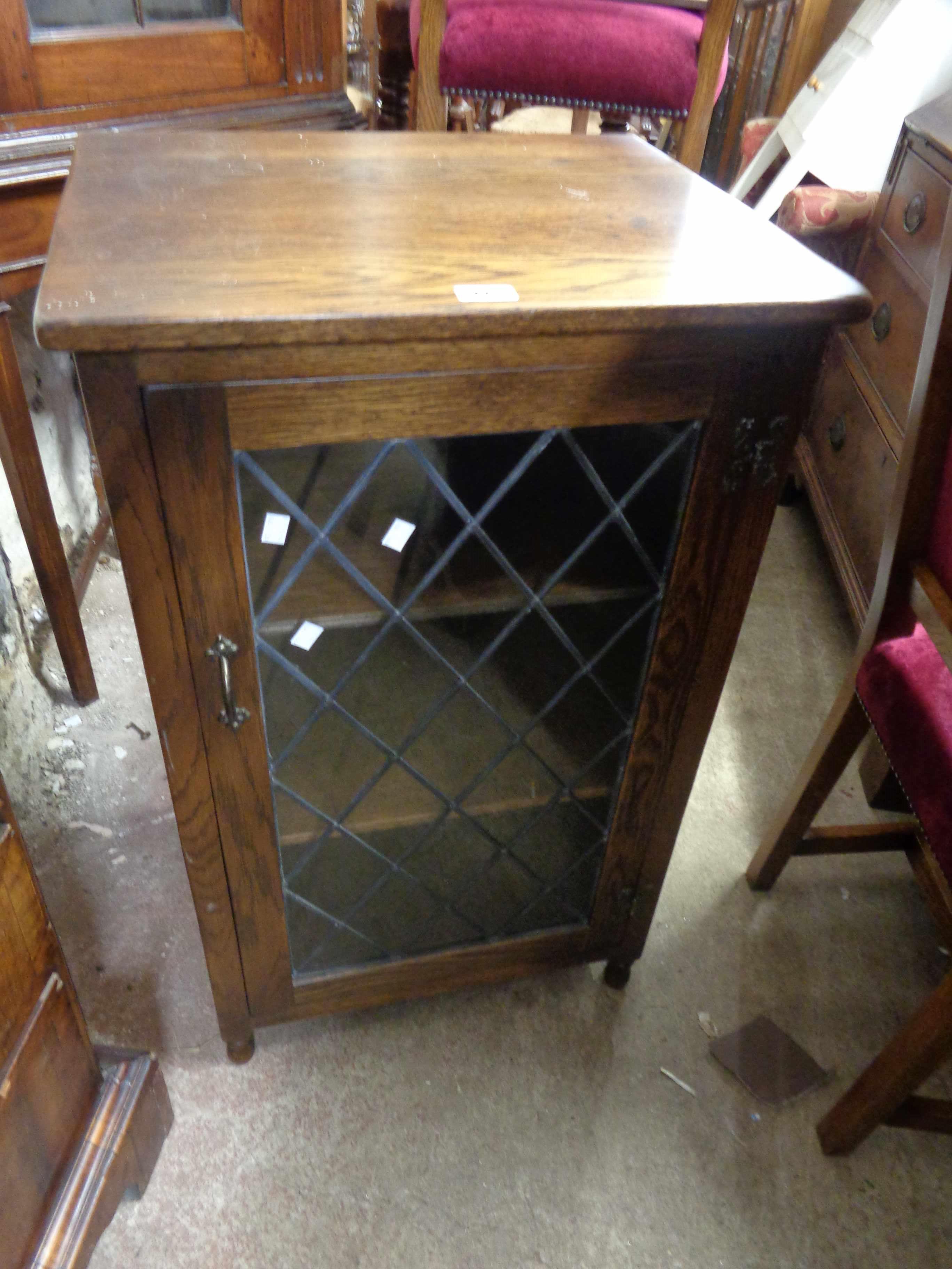 A 55cm vintage Webber Furniture oak hi-fi cabinet with leaded glazed panel door