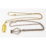 A 375 (9ct.) gold box-link neck chain with Egyptian yellow metal pendant - sold with an English