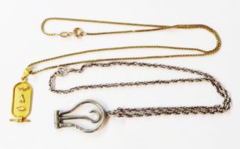 A 375 (9ct.) gold box-link neck chain with Egyptian yellow metal pendant - sold with an English