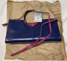 A Daniela Moda pink and ultramarine blue leather designer handbag - as new