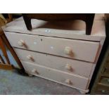 A 91cm later pink painted chest of three long graduated drawers, set on turned feet