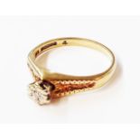 A 375 (9ct.) gold illusion set small diamond solitaire ring - size N 1/2