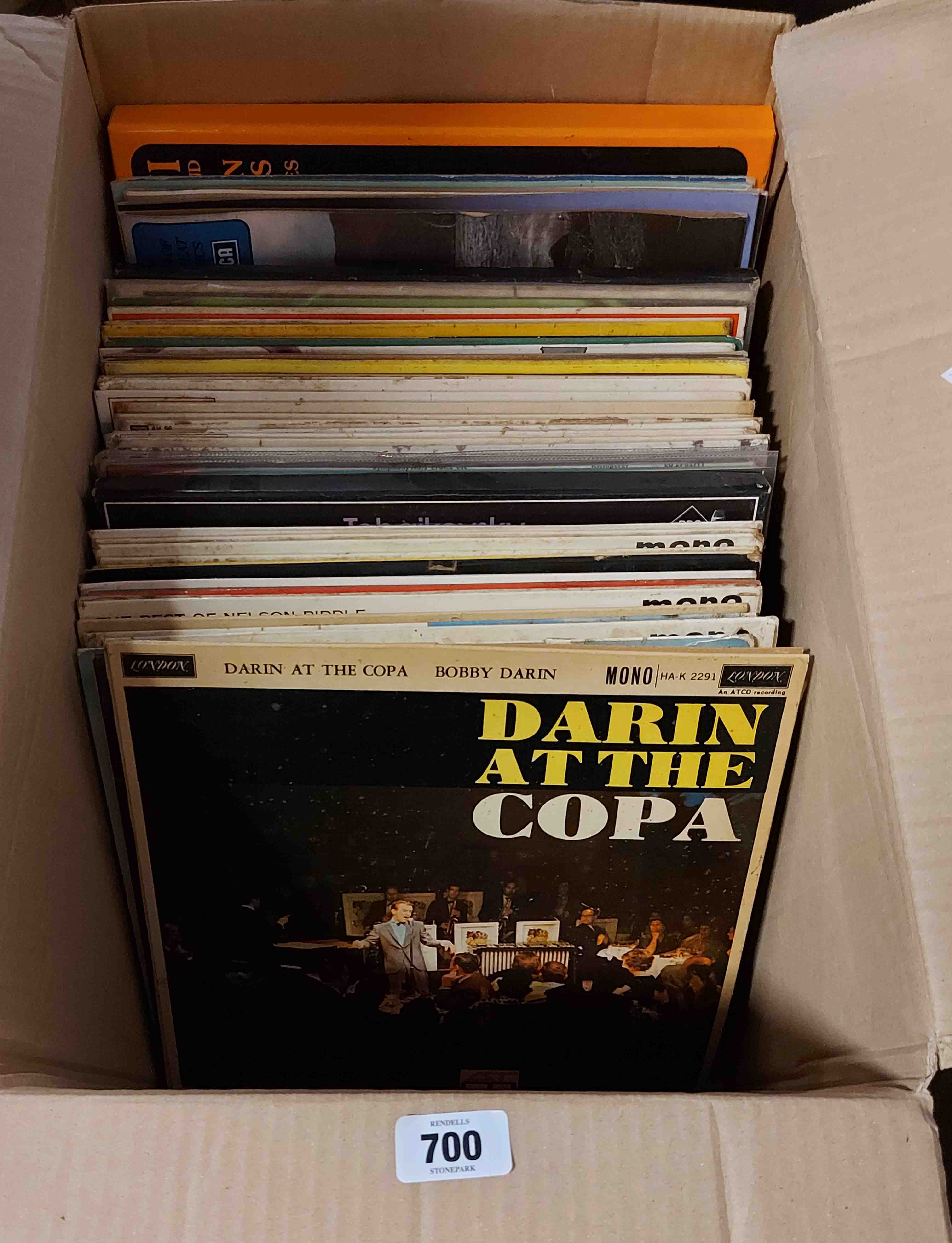 A box containing LP records including Bobby Darrin at the Copa, etc.