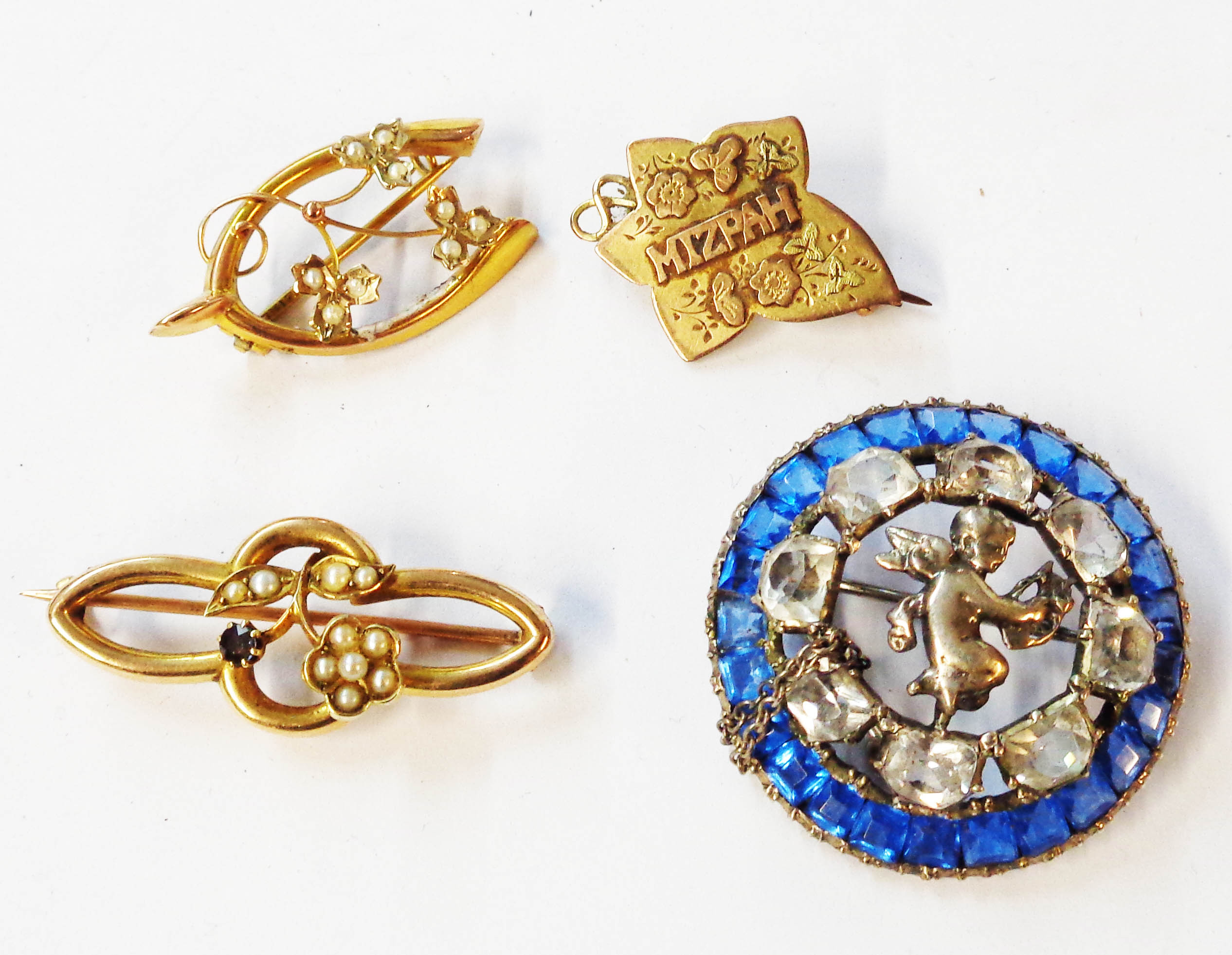 Three early 20th Century marked 9ct. seed pearl set brooches, a 375 (9ct.) gold 'Mizpah' brooch