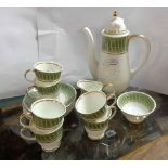 A Susie Cooper bone china part coffee set comprising coffee pot (a/f), six cups and saucers, cream
