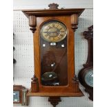 An early 20th Century walnut cased regulator style wall clock with Gustav Becker spring driven