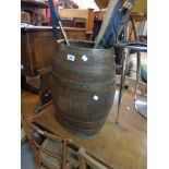 An old coopered oak barrel of tapered form