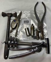 A bag containing a quantity of metalware including corkscrew, toffee hammer, etc.