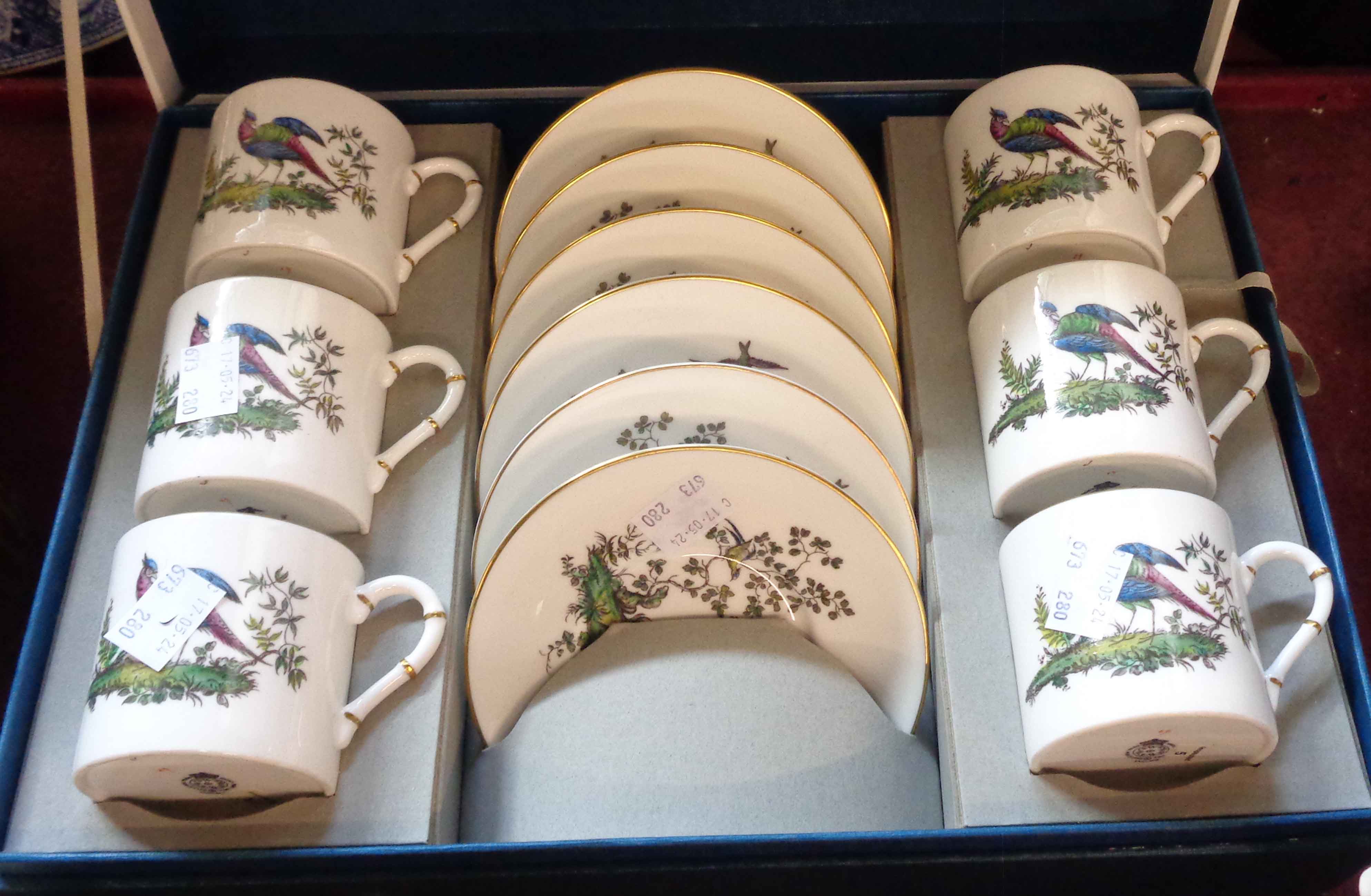 A boxed Royal Worcester bone china coffee set comprising six coffee cans and saucers decorated