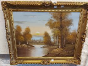 †Chapman: an ornate gilt framed oil on canvas, depicting a woodland river landscape at sunset -