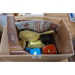 A box containing a vintage lucite dressing table set, souvenir boomerang, etc.