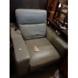 A modern grey leatherette upholstered electric reclining armchair