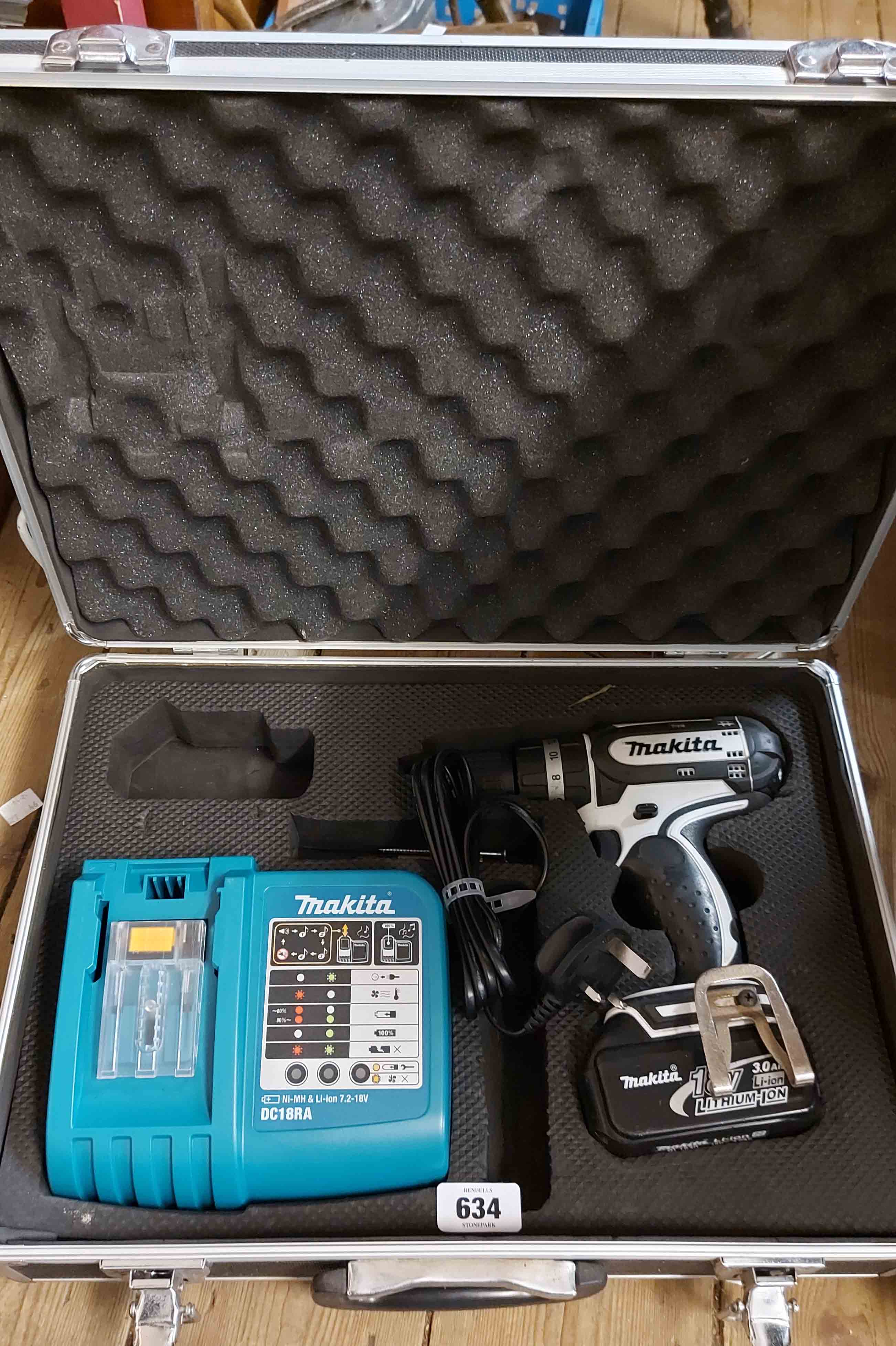 A cased Makita LI/ION rechargeable drill