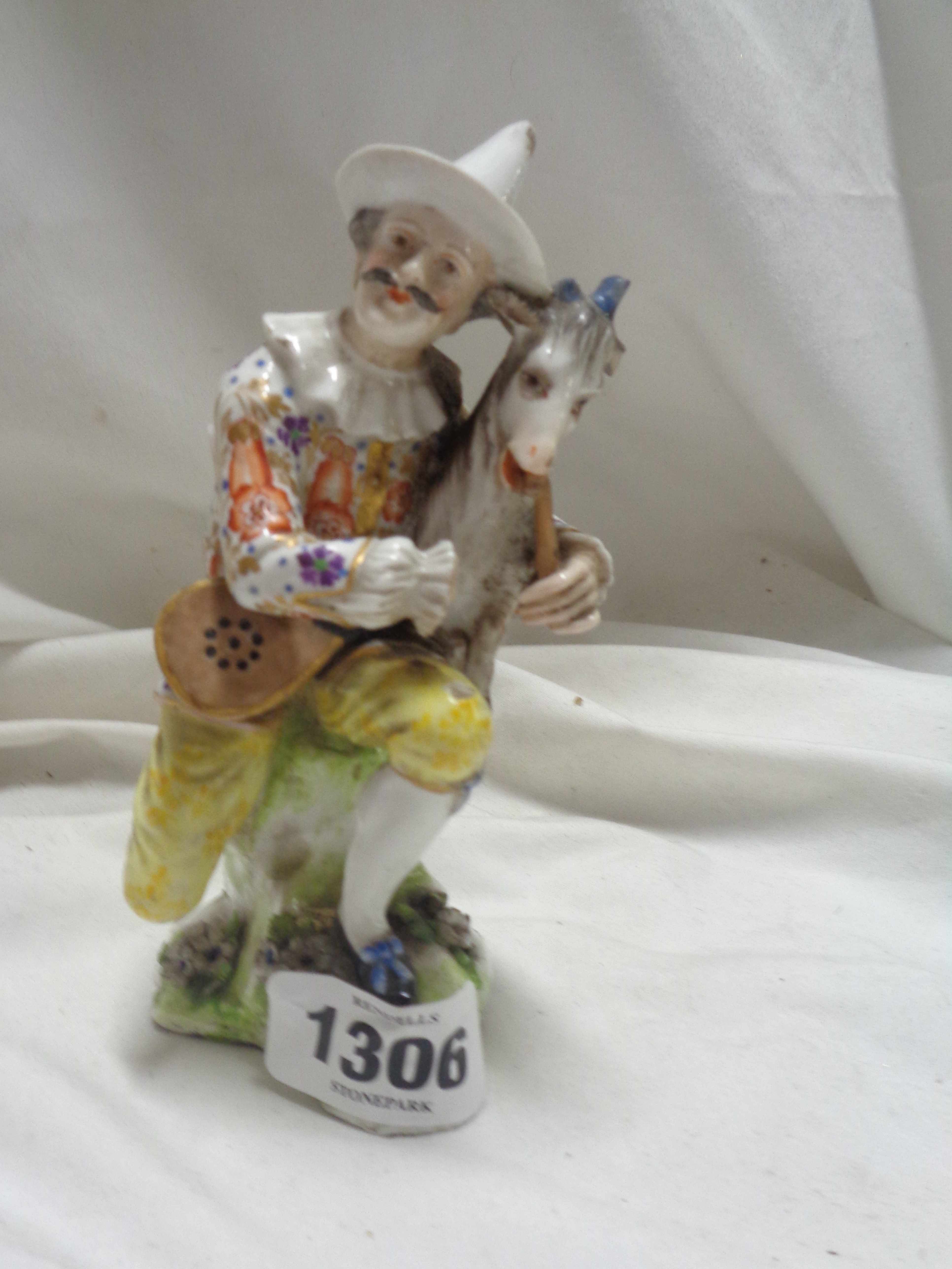 An antique Chelsea style porcelain figurine, depicting a man with a goat - gold anchor mark to