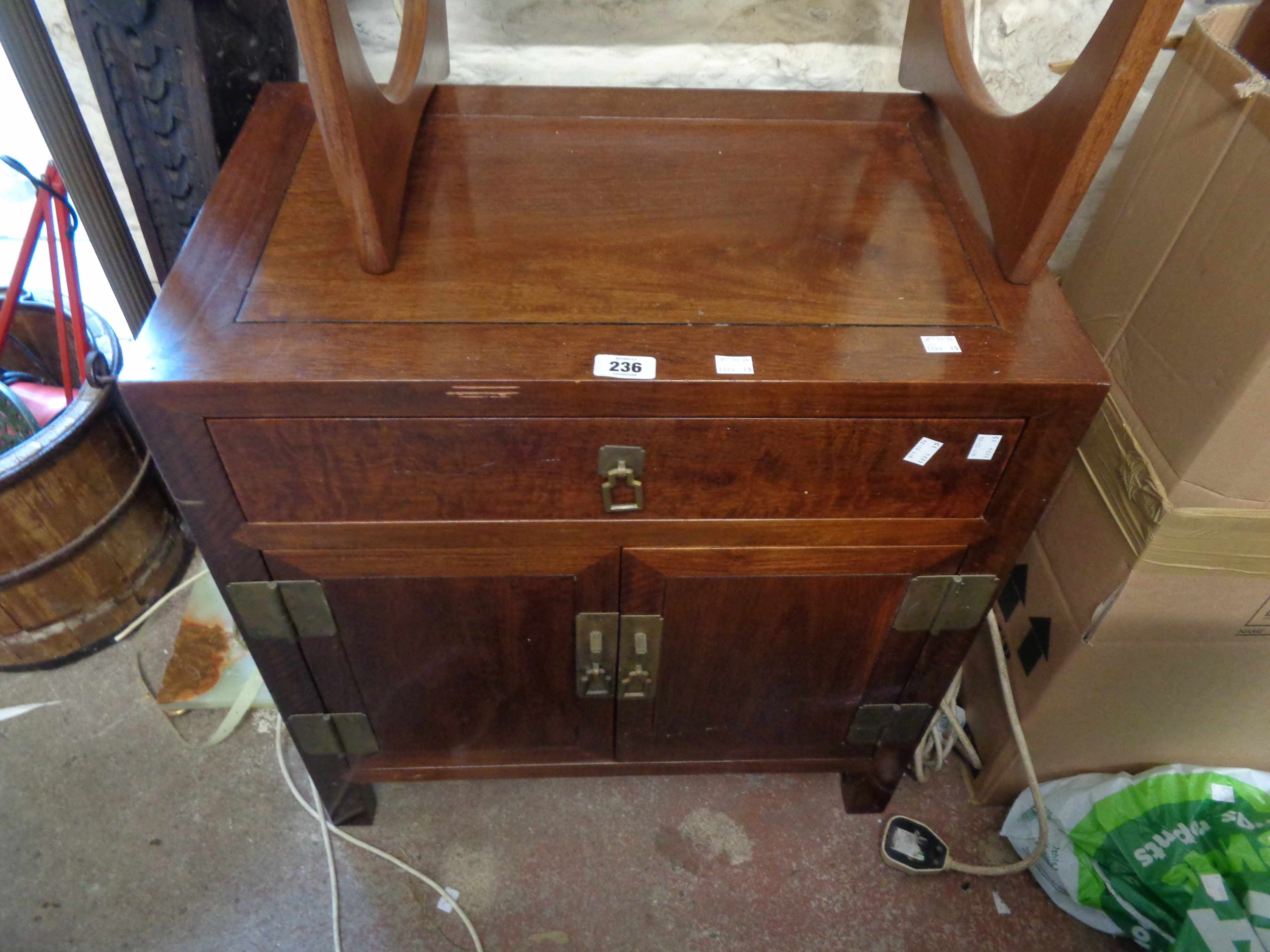 A 62cm modern Chinese polished hardwood low cabinet with drawer and double cupboard, set on block