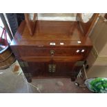 A 62cm modern Chinese polished hardwood low cabinet with drawer and double cupboard, set on block