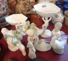 A small selection of ceramics including a Lladro angel figurine, figural shell comports, etc.