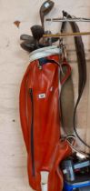 A 1950's Gibbson & Gadd driver and niblick irons golf clubs in red gold bag