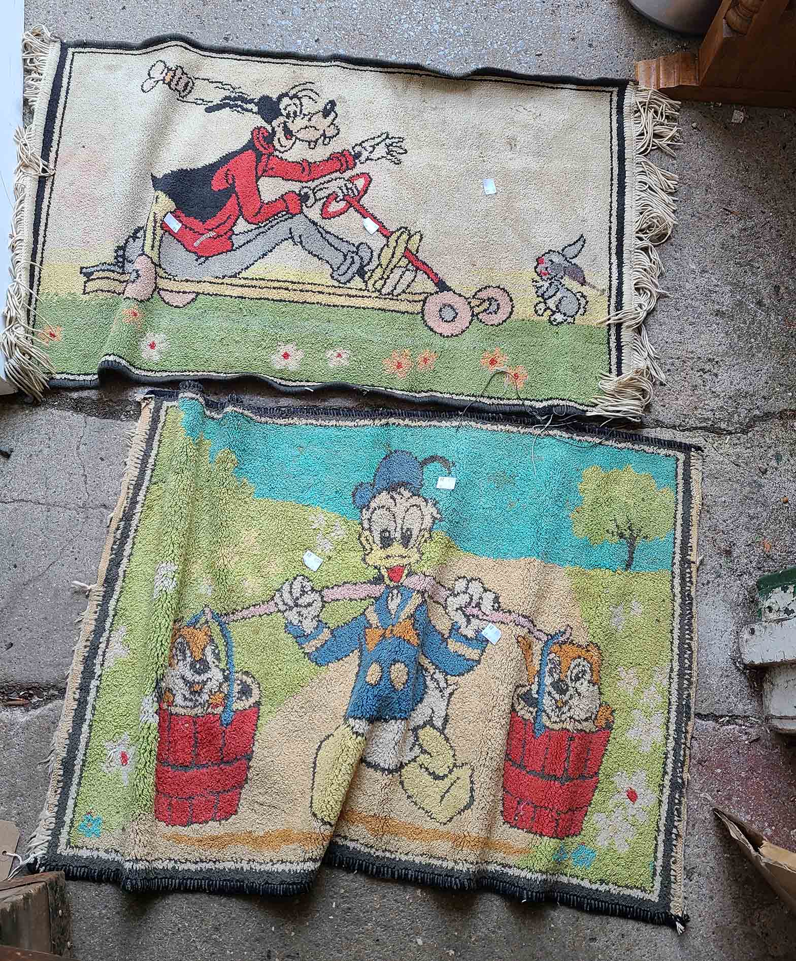 A pair of small vintage Walt Disney mats, depicting Donald Duck, Chip n Dale and Goofy